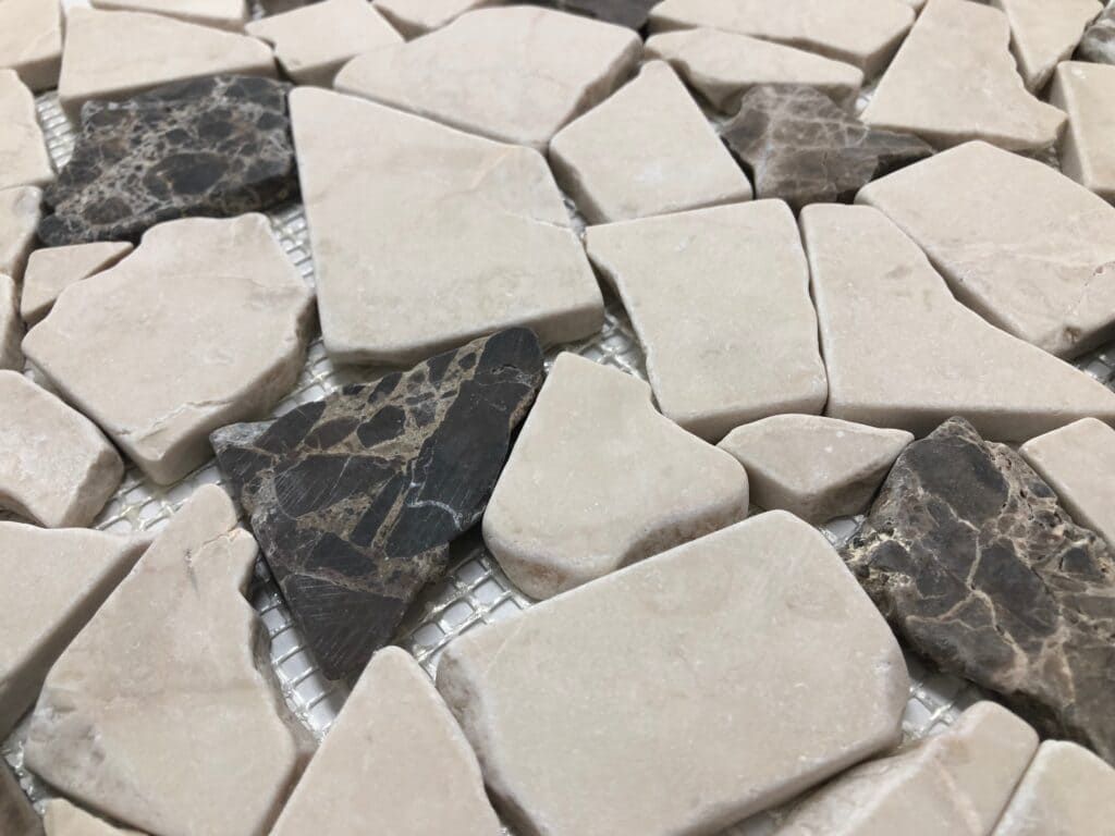 Natural stone mosaic tile with earthy tones, perfect for rustic interior walls.