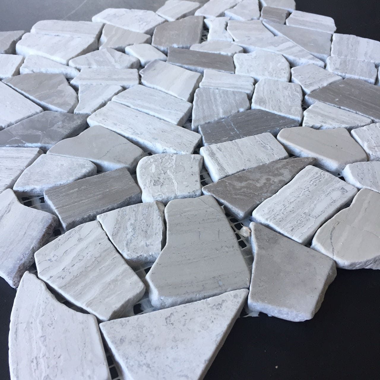 Closeup shows detail inside Silverwood Pietra mosaic stones and grain highlights.