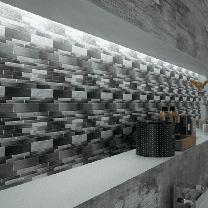 Volantis Glass tile with ombre tones and mixed glass widths, stylish for kitchen backsplash or bar area.