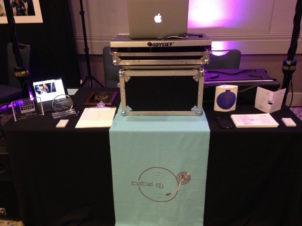 A laptop is sitting on top of a case on a table