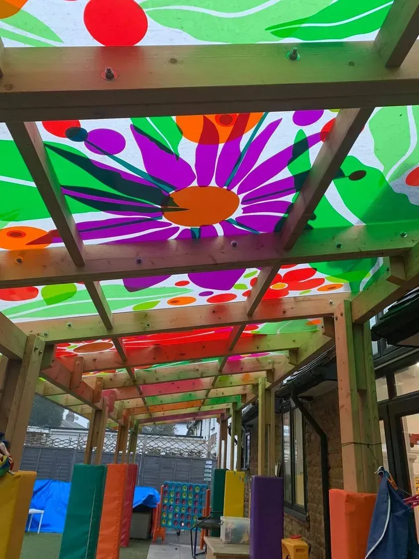 A colorful canopy with a picture of a flower on it