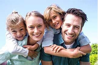 Happy parents with their children DiSano Dental Group Wakefield, RI