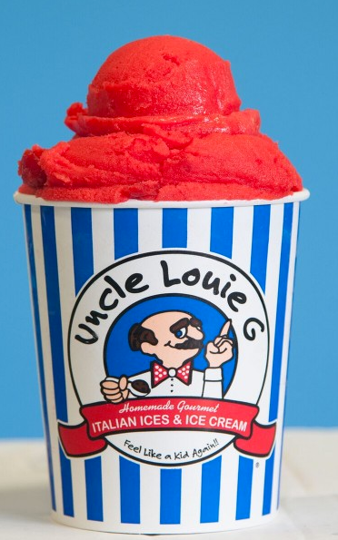 Red Italian ice in a blue and white striped cup from Uncle Louie G's.