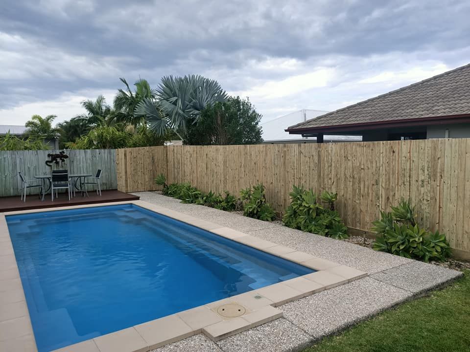 Pool With Blue Water and Steps, Next to a Pebble Path — Quality Fences 4 U in Gympie, QLD