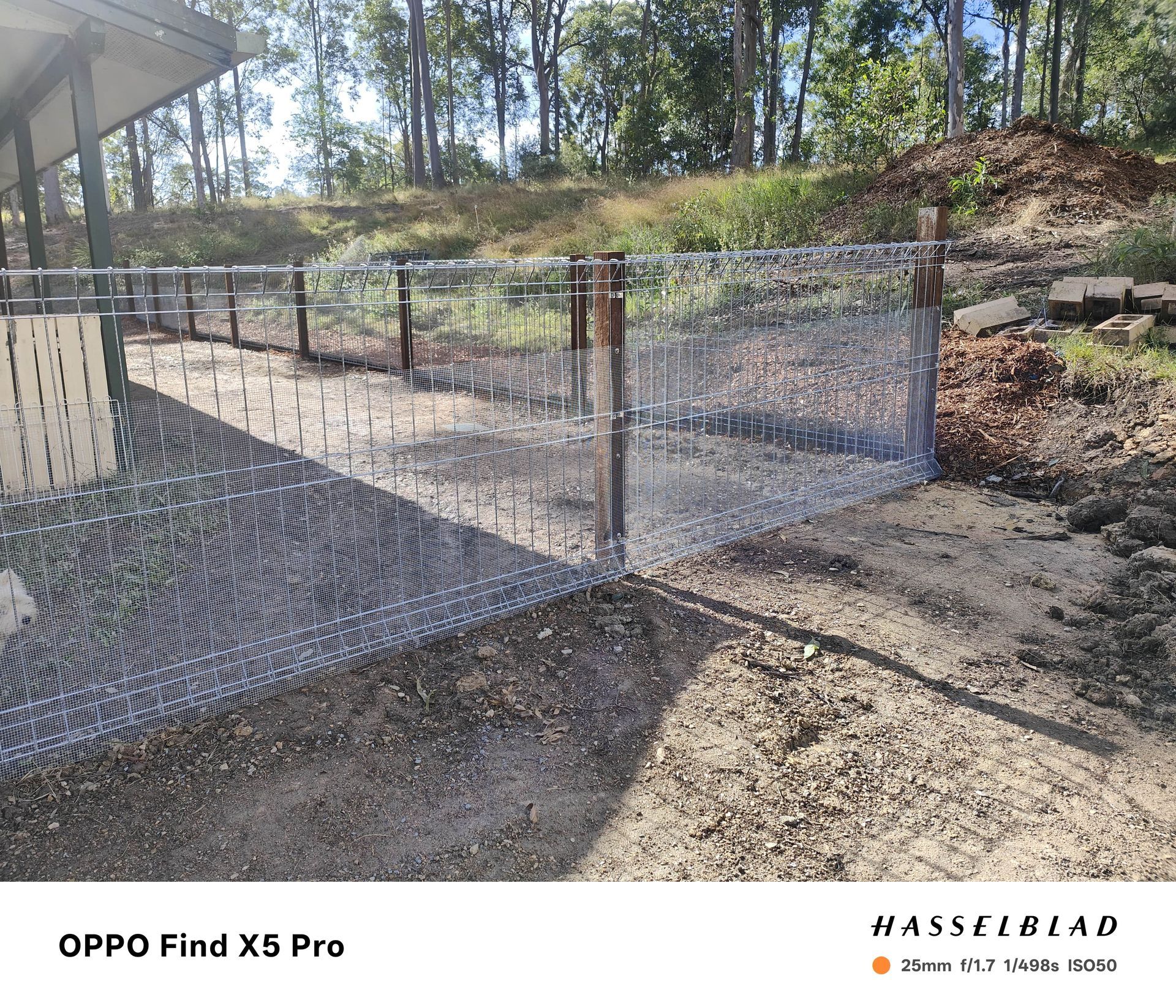 Wire fence with wooden posts in an outdoor setting — Quality Fences 4 U in Gympie, QLD