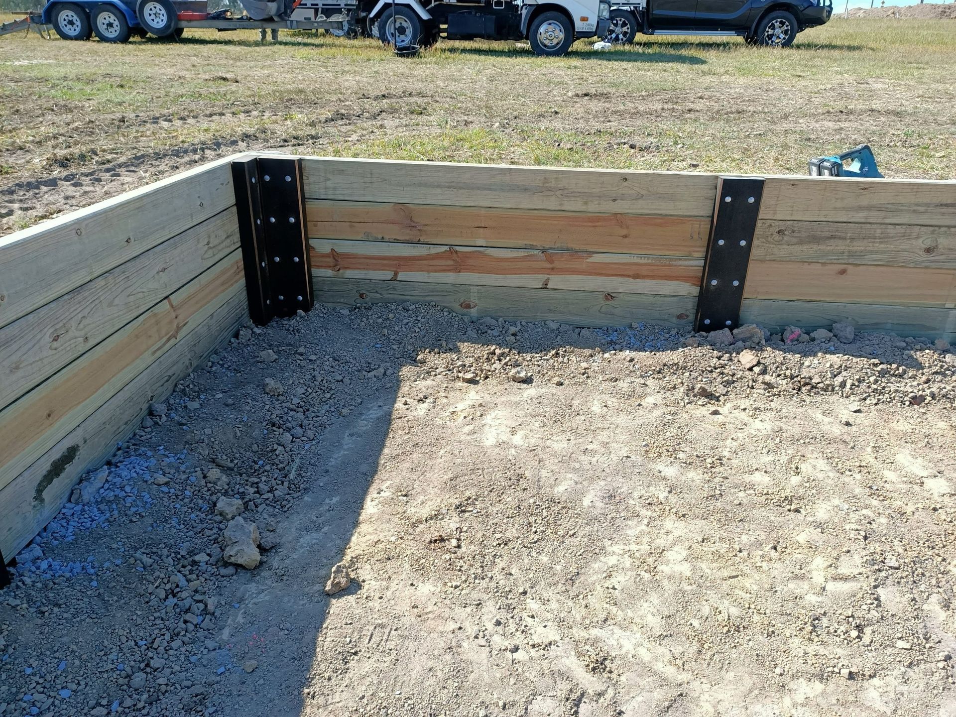 Wooden Retaining Wall Under Construction — Quality Fences 4 U in Gympie, QLD