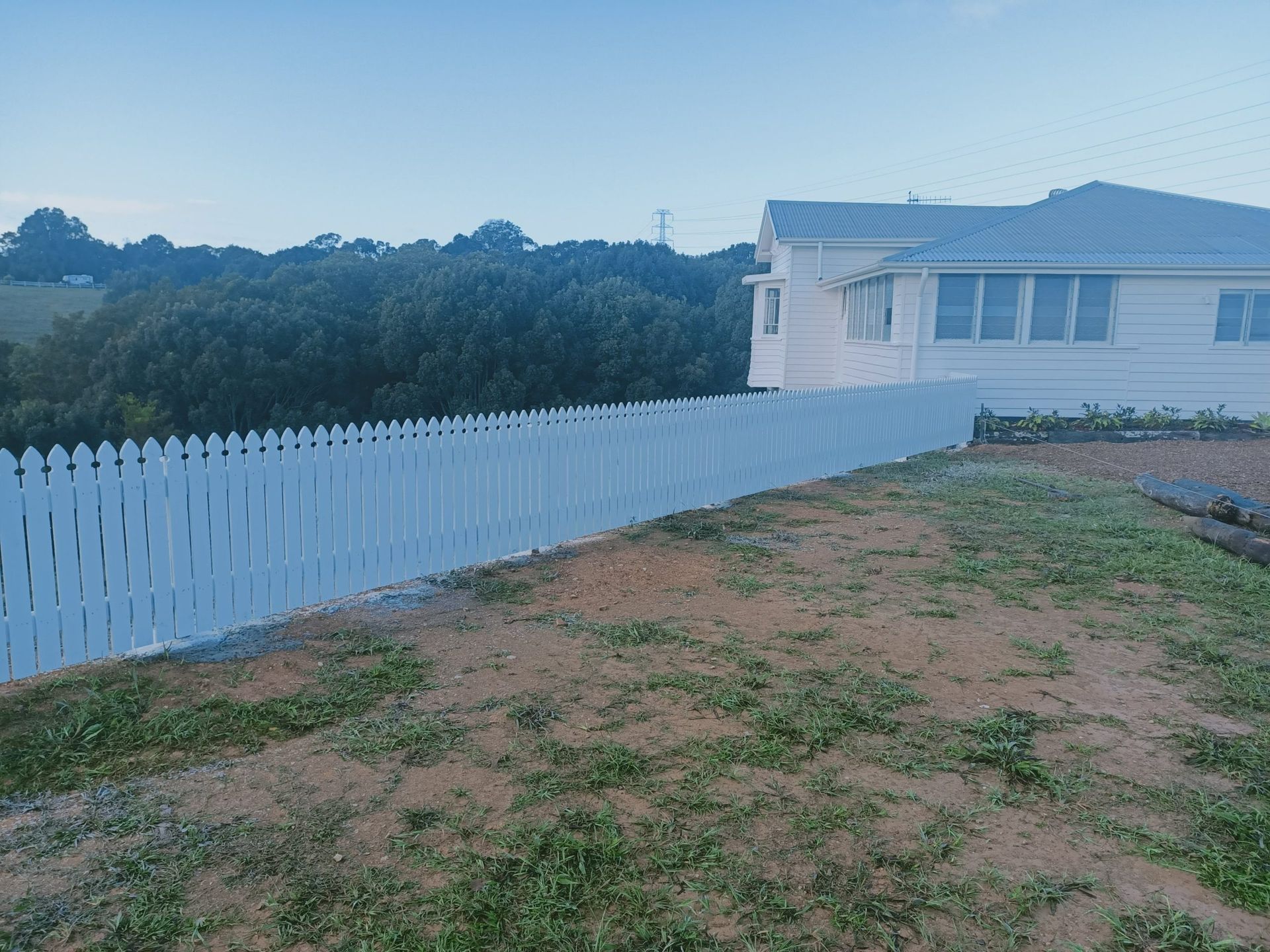 White Picket Fence Runs Along a Yard — Quality Fences 4 U in Gympie, QLD