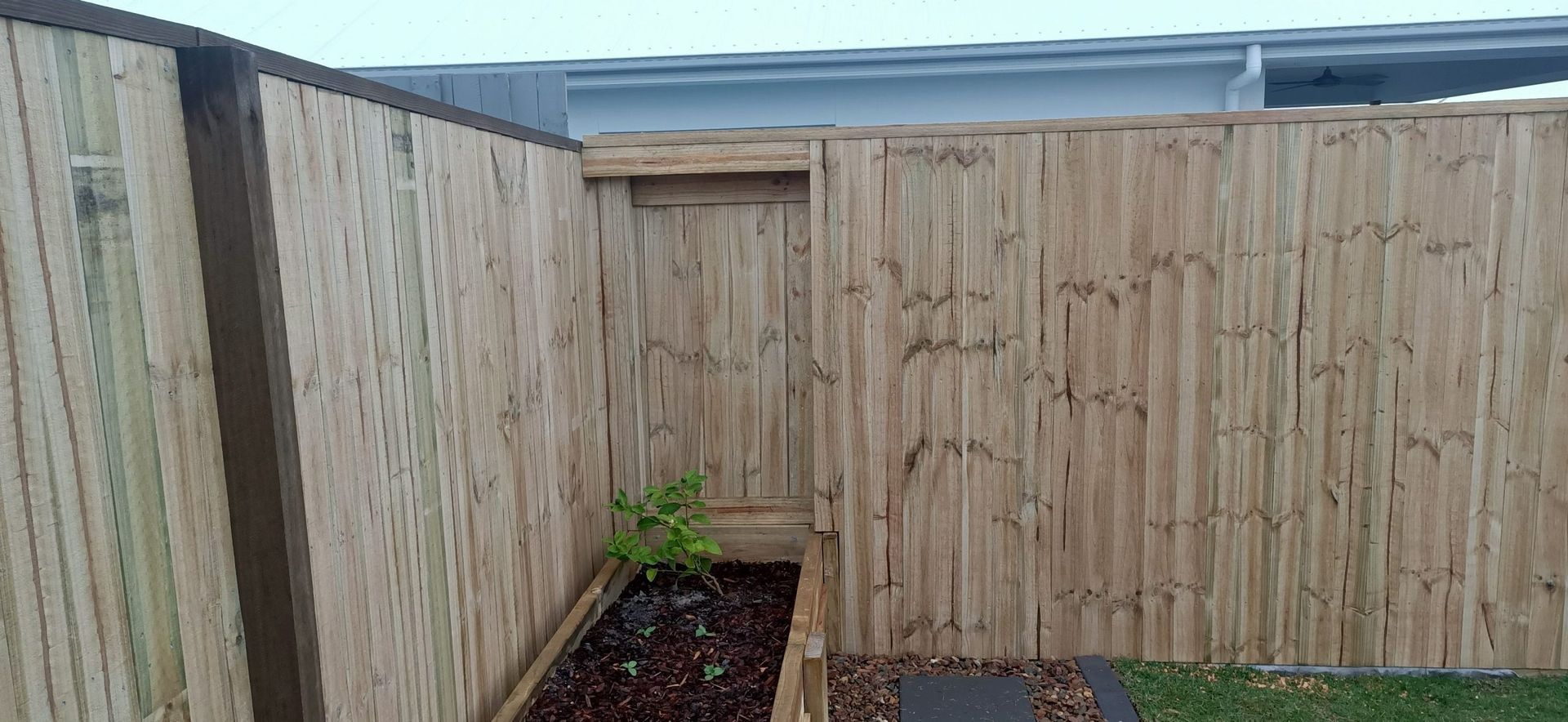 Wooden Fence With a Small Garden Area — Quality Fences 4 U in Cooroy, QLD