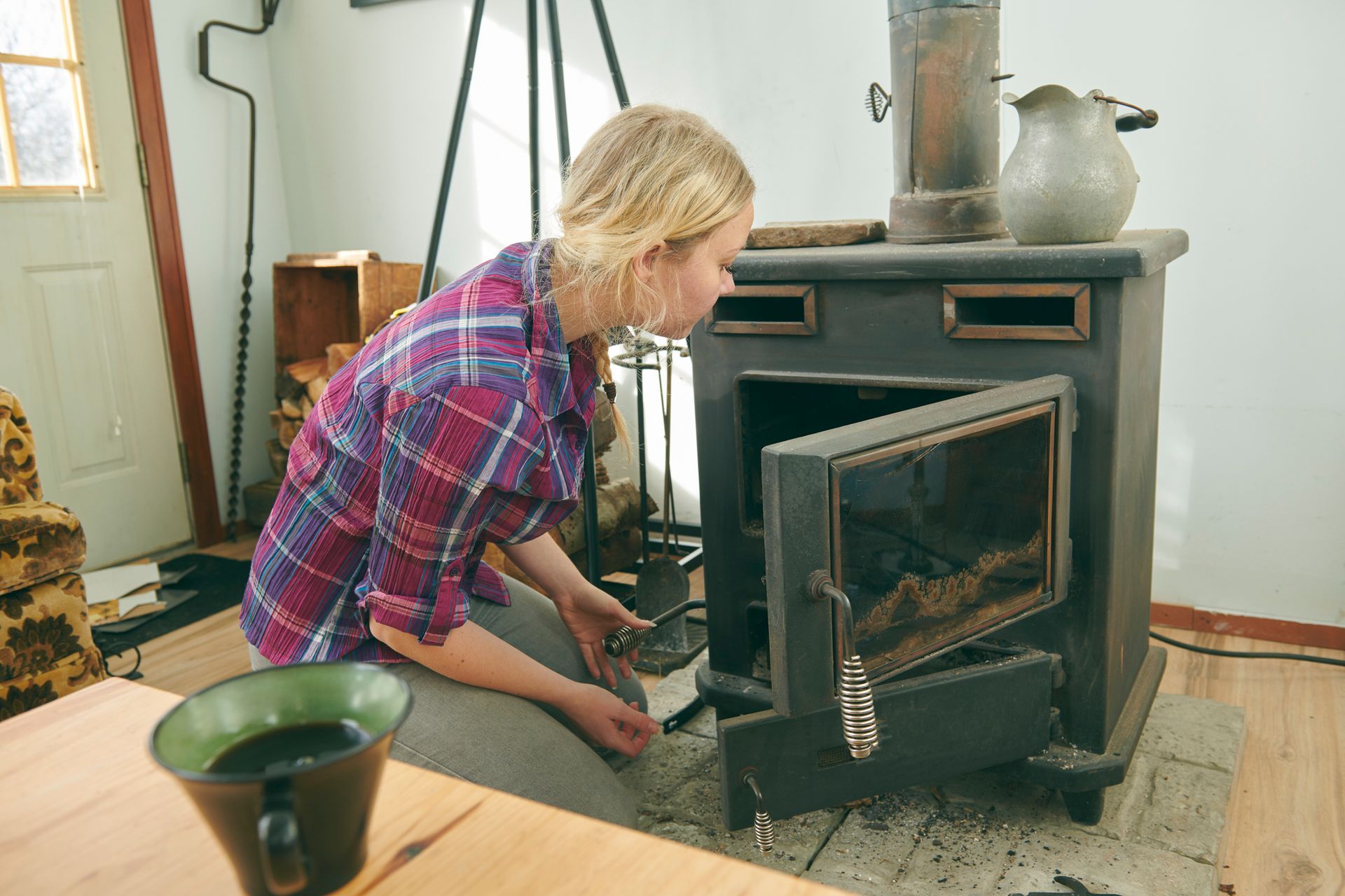 The owner is preparing the fire in the fireplace – Macungie, PA - Anytime Todd's Chimney Sweeping