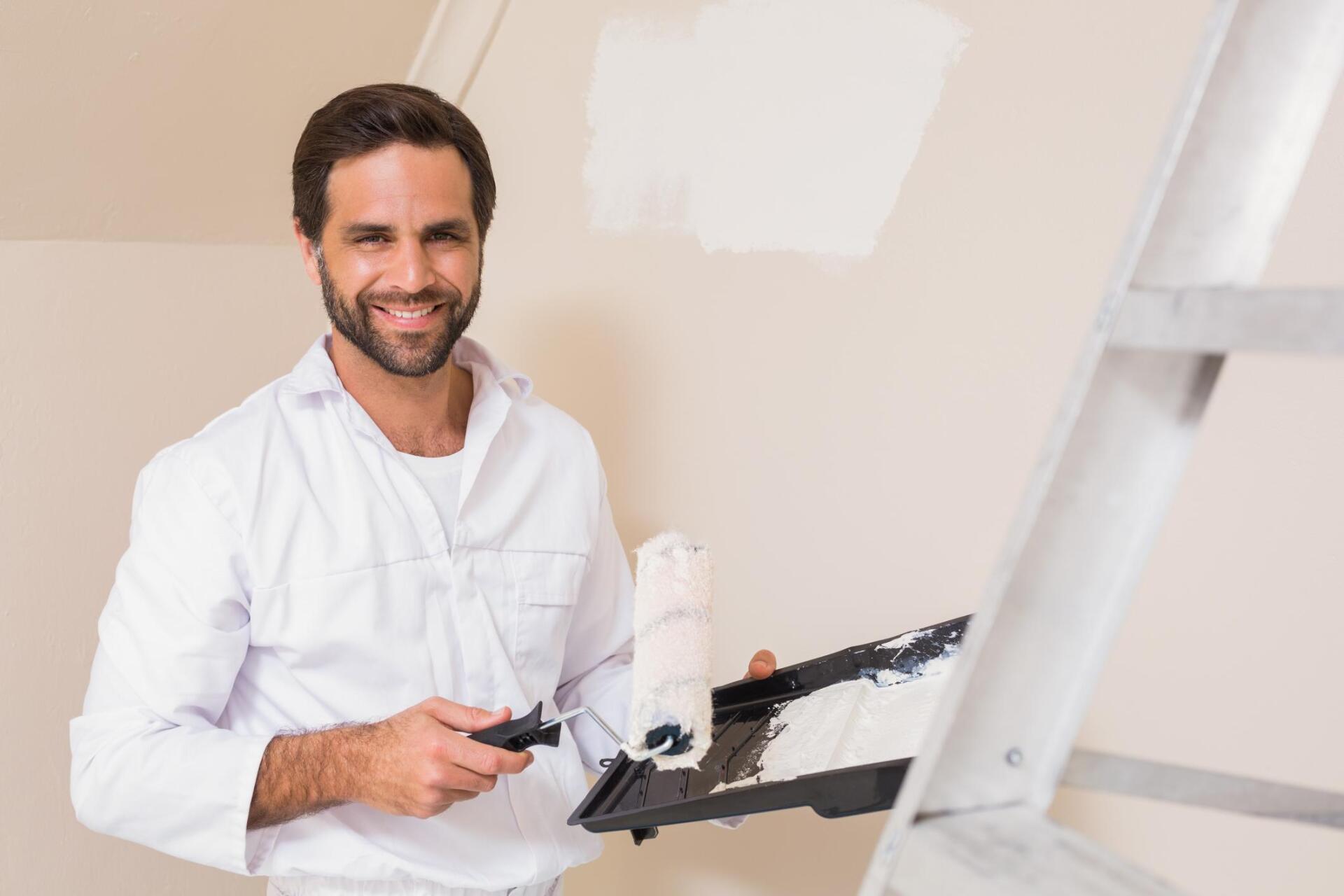 man holding a paint roller
