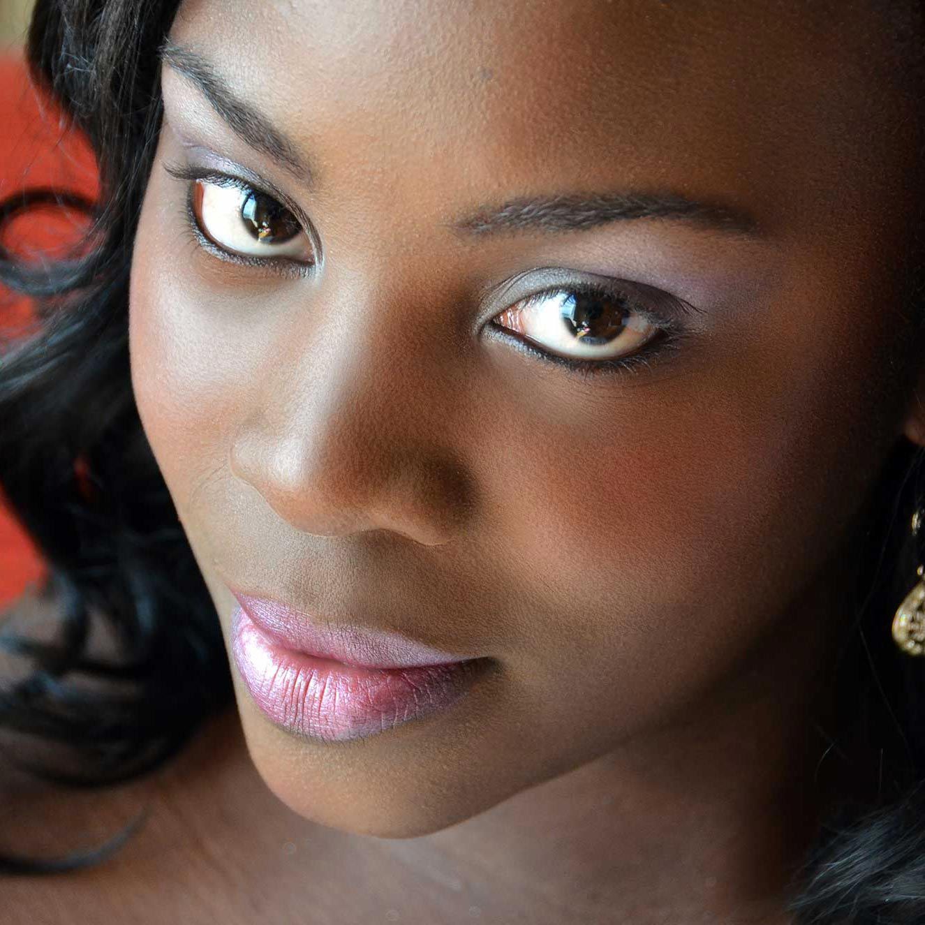 A close up of a bride's face with retouching of blemishes.