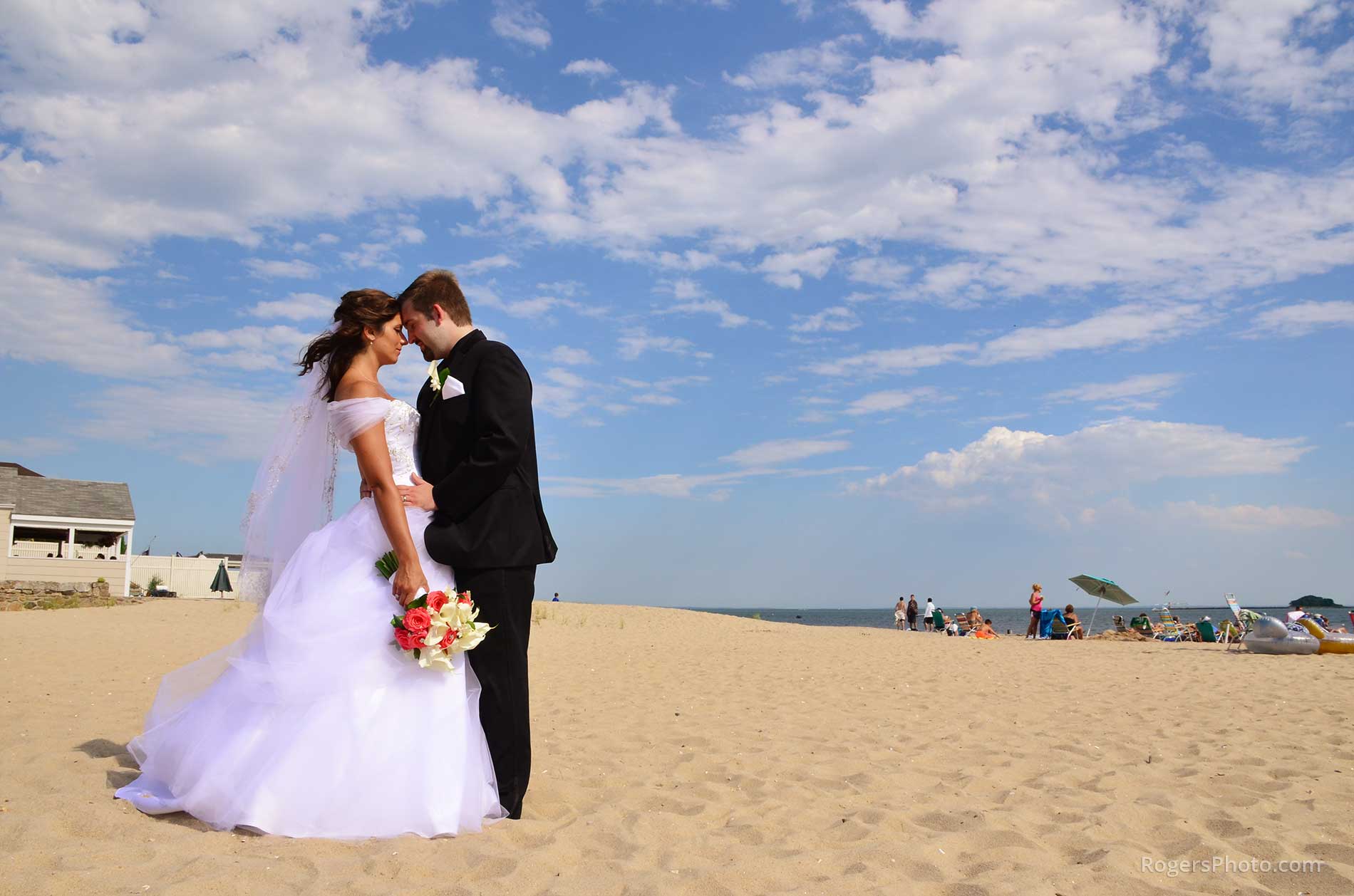 a bride and groom on the beach before major photo retouching