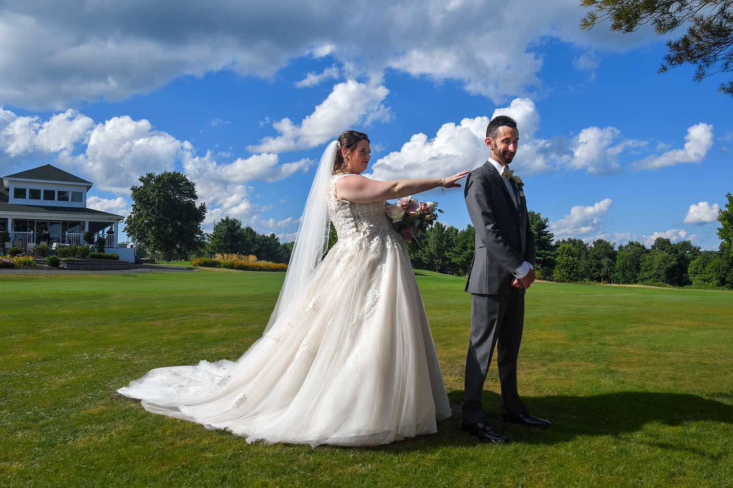 a bride and groom on a golf course before major retouching