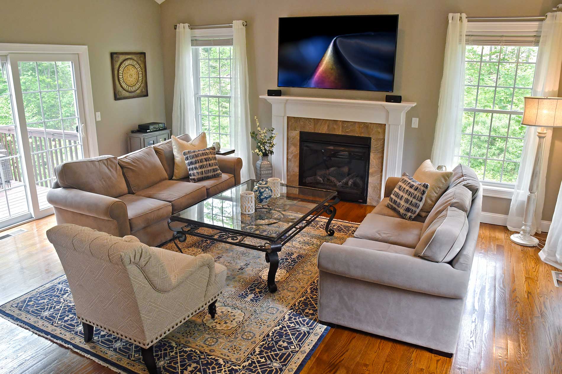 A living room filled with furniture and a fireplace for Real Estate photography by Rogers Photography.