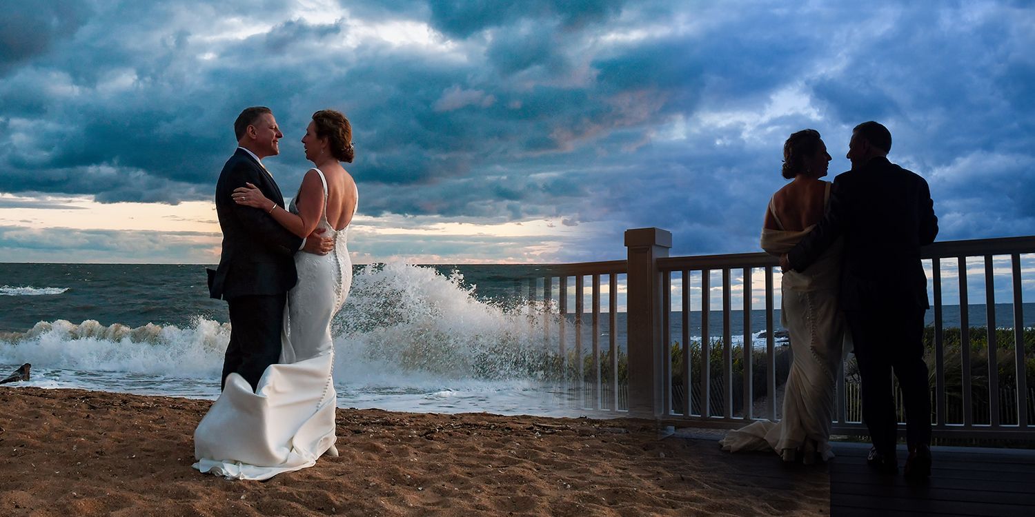 A bride and groom pose for a wedding photograph at Madison Beach Hotel wedding photography by Connecticut Photographers Rogers Photography