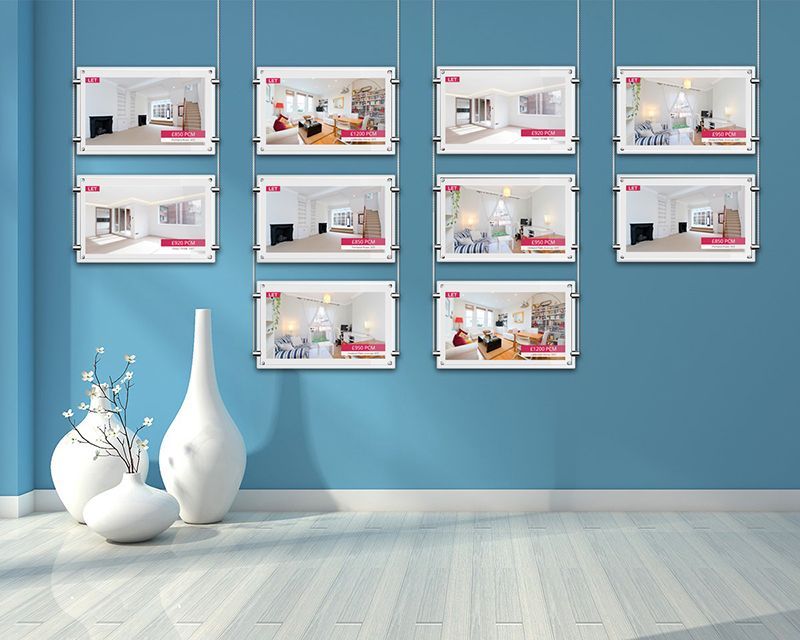 a room with a blue wall and a lot of pictures on the wall