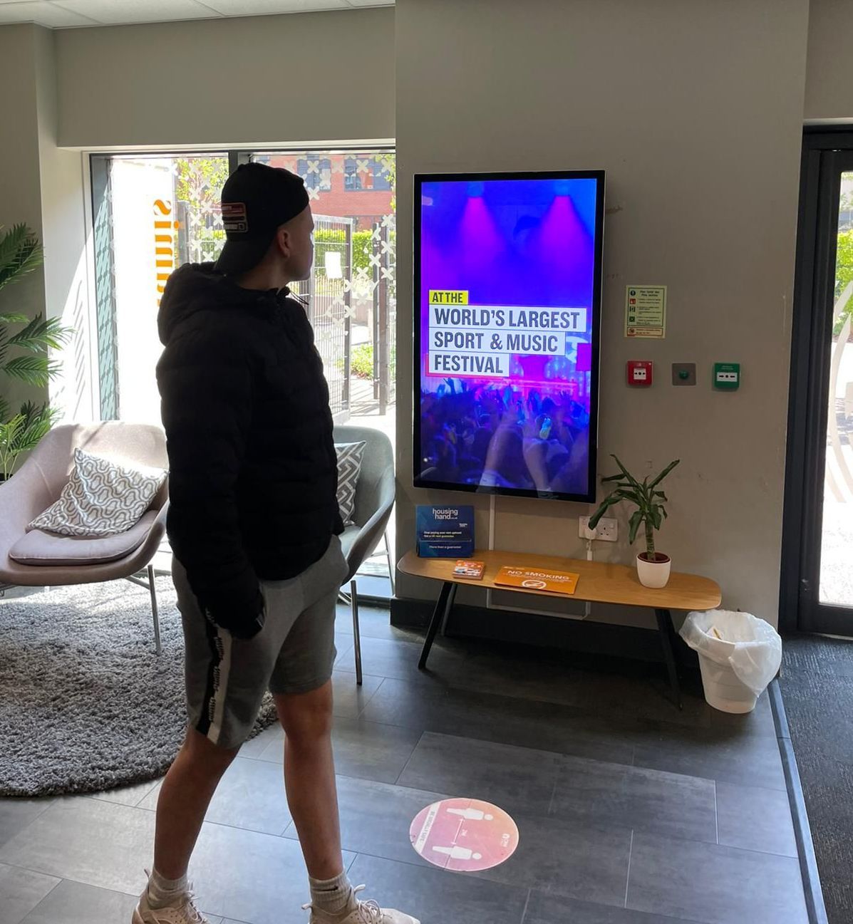 a man standing in front of a tv that says spirit & fruit festival