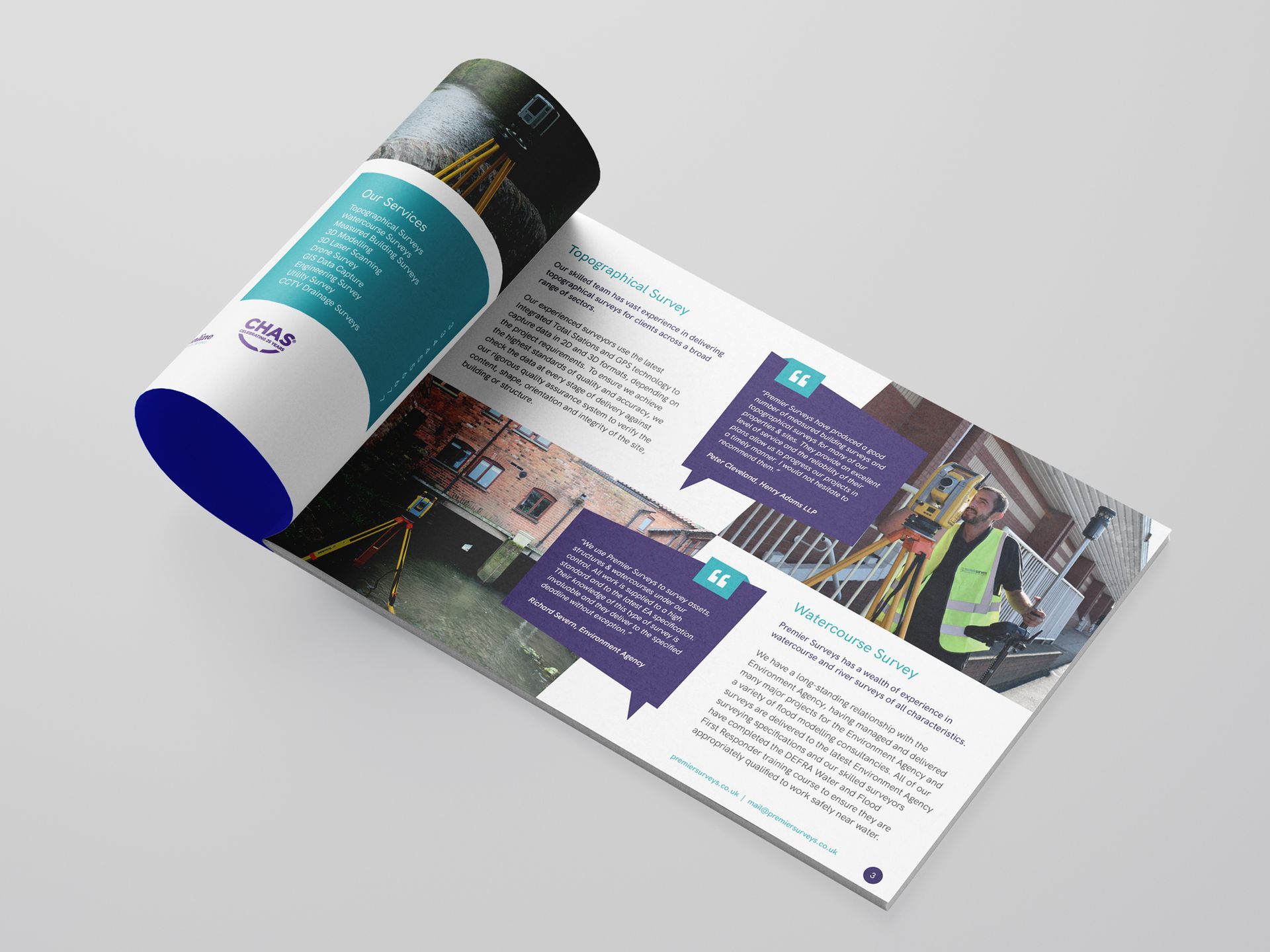 A brochure for Premier Surveys is open to a page with a picture of a building.