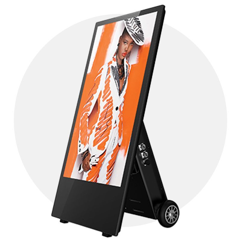 Digital A-frame sign with woman in orange outfit, black frame, wheels for easy movement, and a gray background.