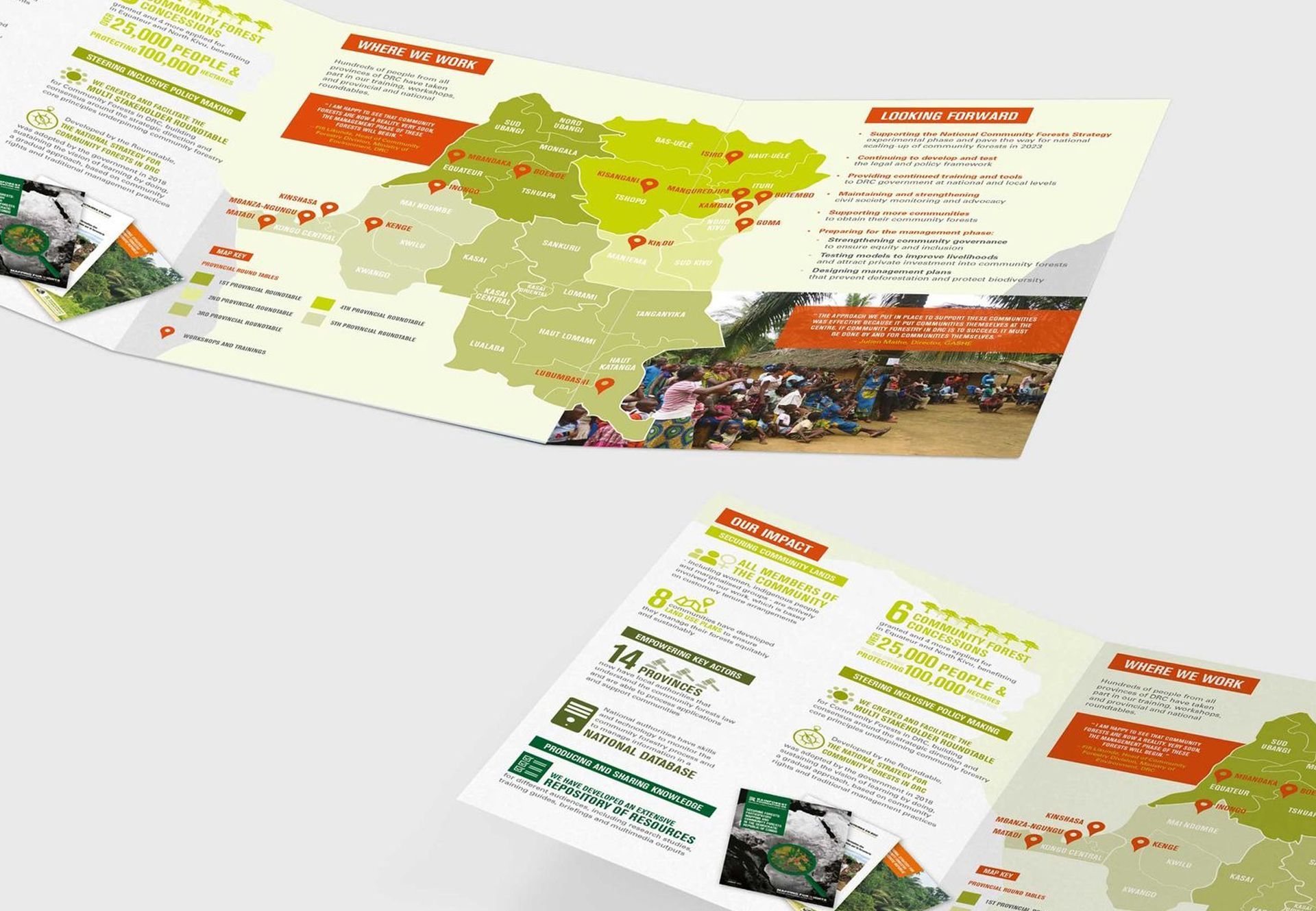 Two open tri-fold brochures with a map and text in orange, green, and yellow.