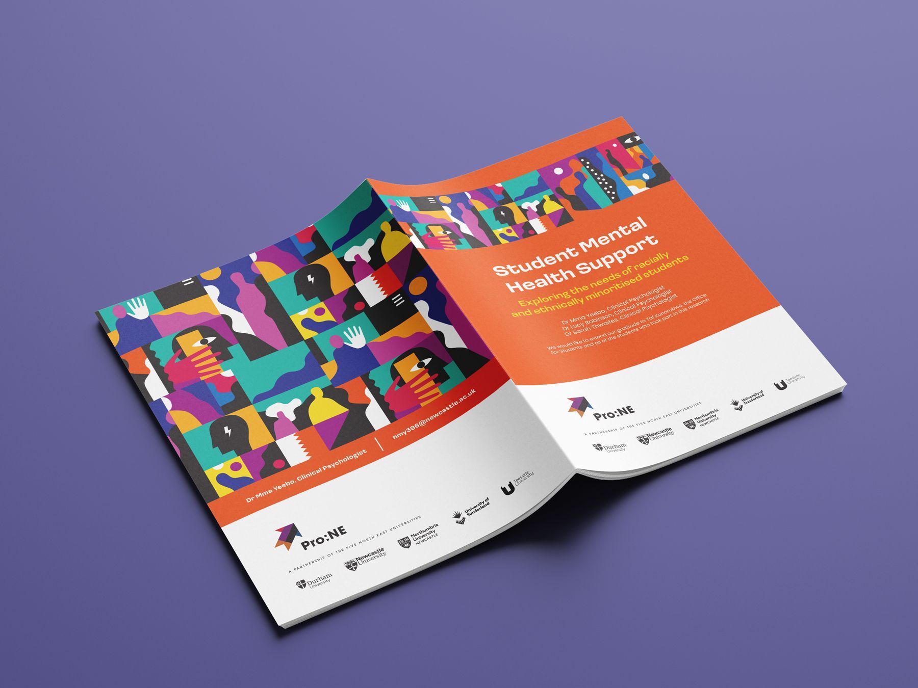 A book is open to a page with a colorful design on it.