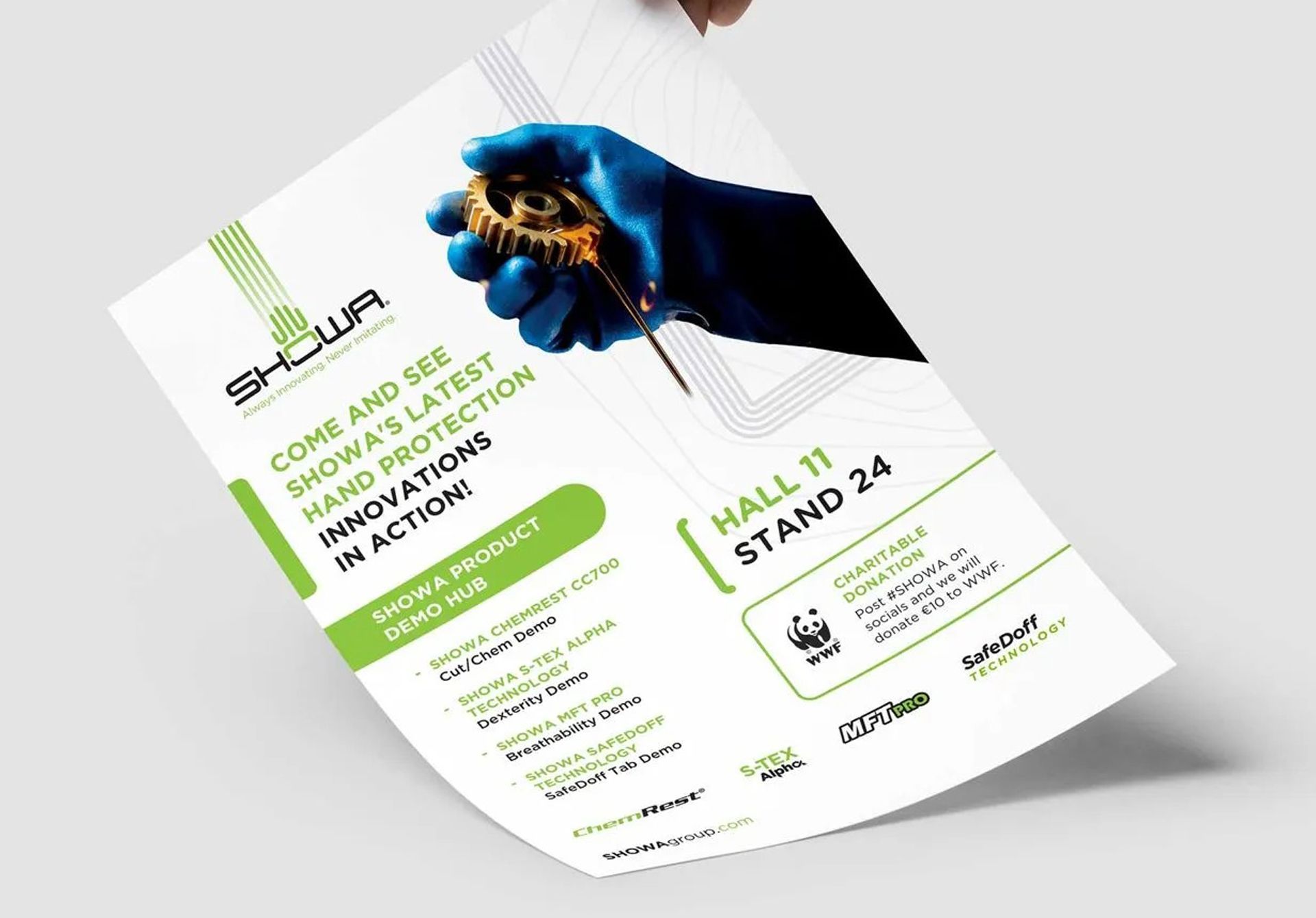 Hand holding a flyer with green and white text; blue gloved hand holding a gold item; stand 24 details visible.