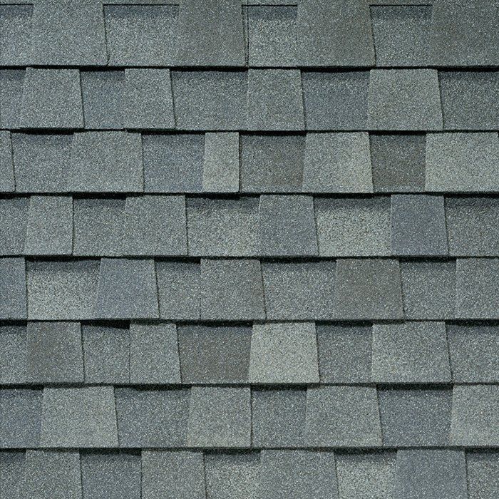 Gray asphalt roof shingles in a repeating pattern.
