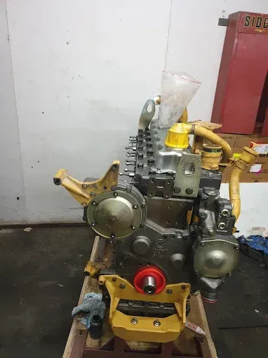 Mechanic Working on Car Engine, Focusing on a Turbocharger — RCM Diesel & Hydraulic Services in West Rockhampton, QLD.