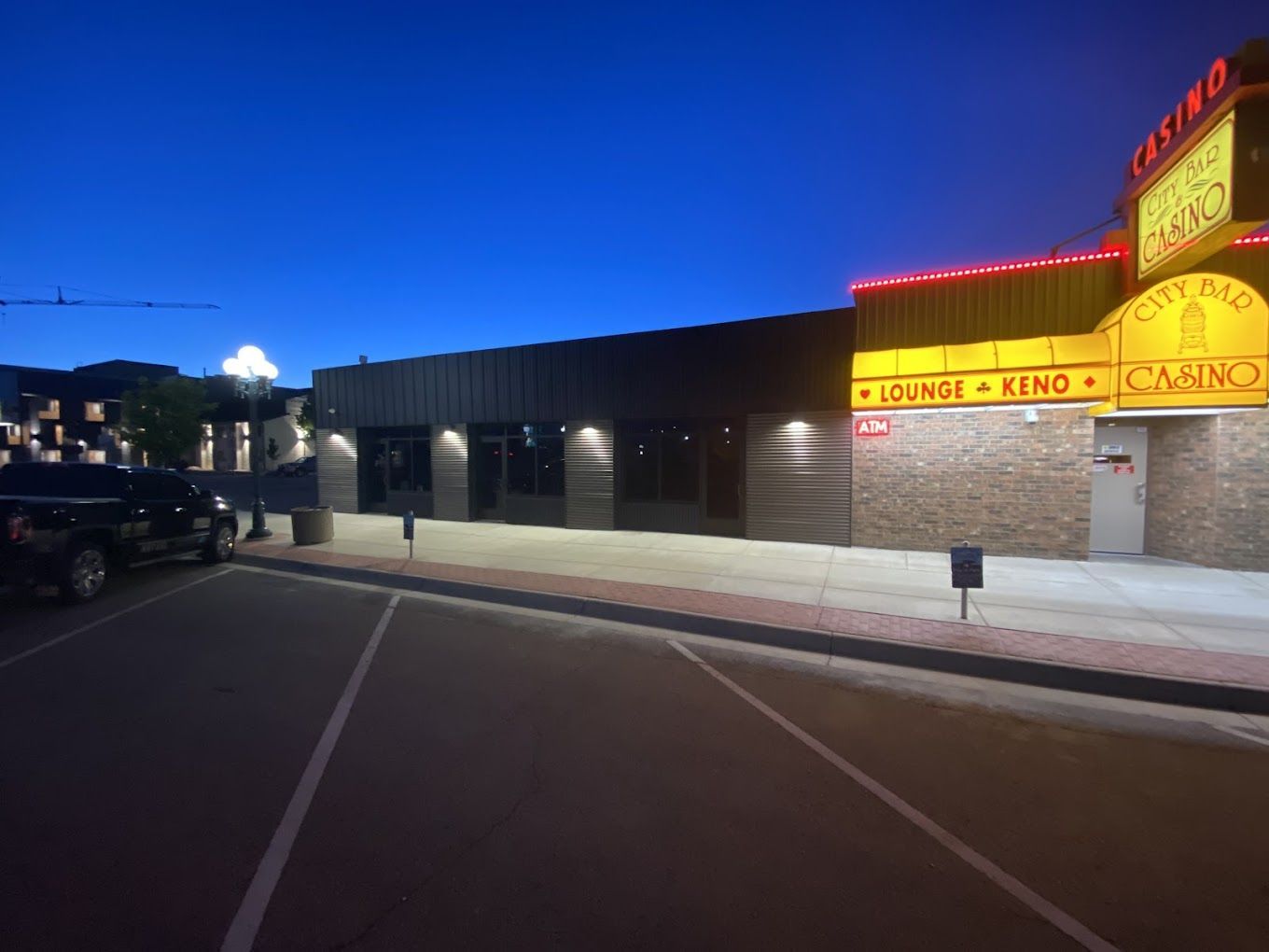 A parking lot in front of a building that says casino