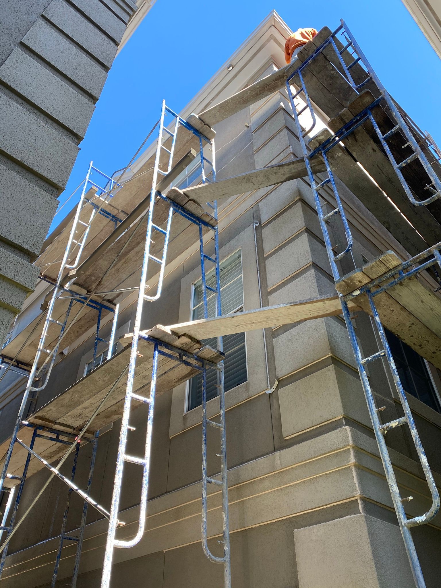 A building under construction with scaffolding on the side of it