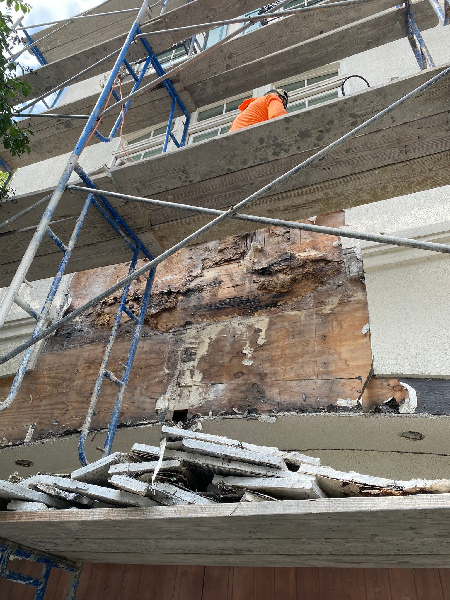 A building under construction with scaffolding on the side of it.