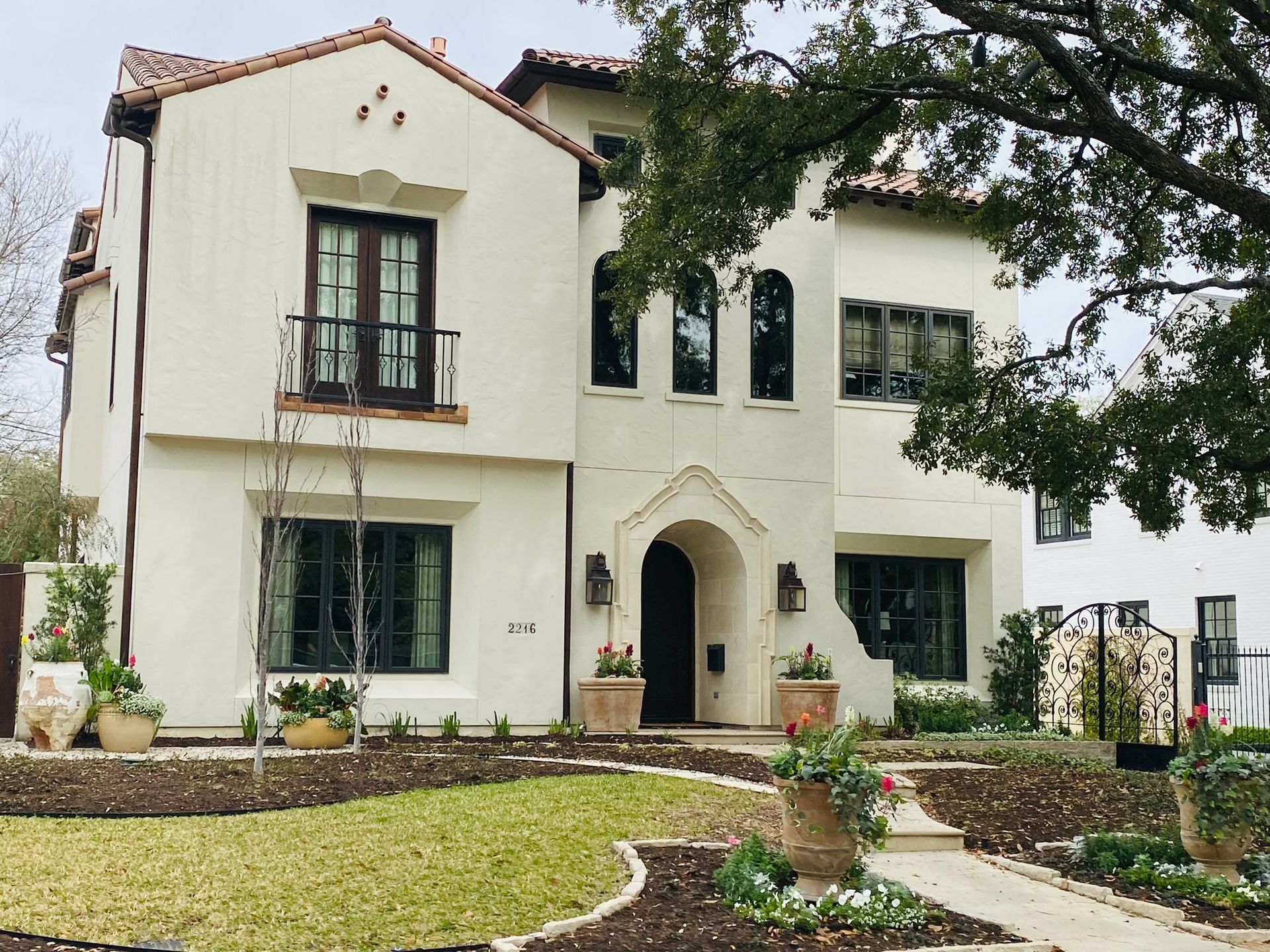 A large white house with a spanish tile roof