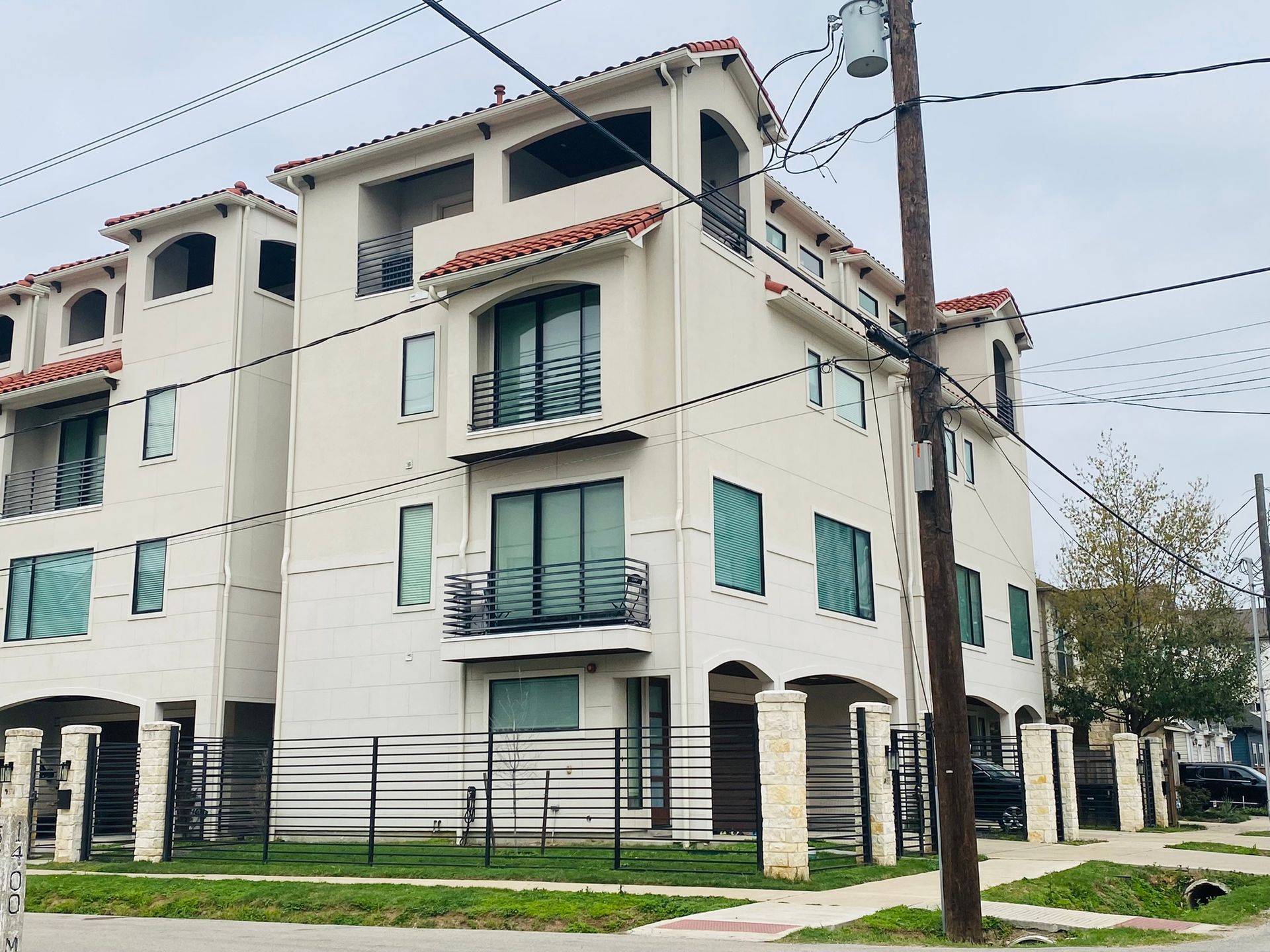 A large white building with a lot of windows and balconies