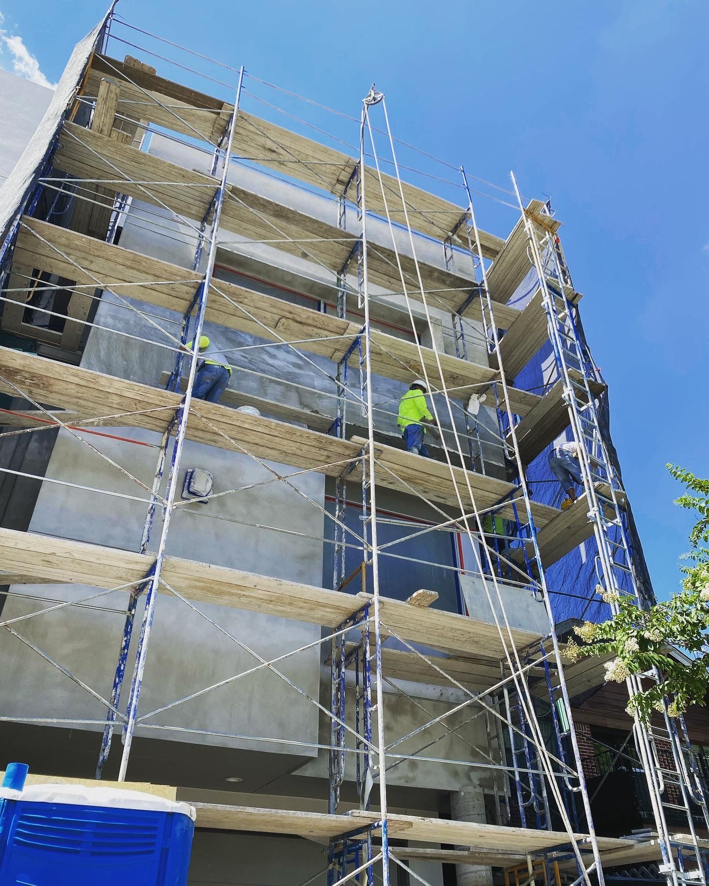 A building under construction with scaffolding on the side of it.