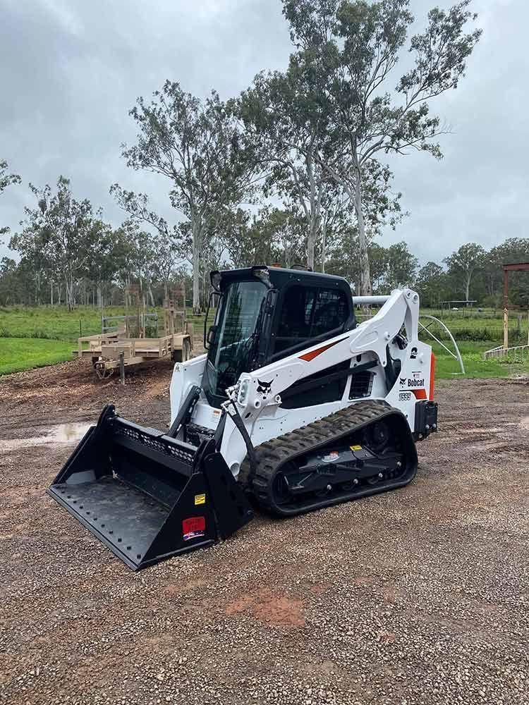 A Bobcat Compact Track Loader is Parked in a Gravel Lot — Blue Gum Earthworks in Atherton, QLD