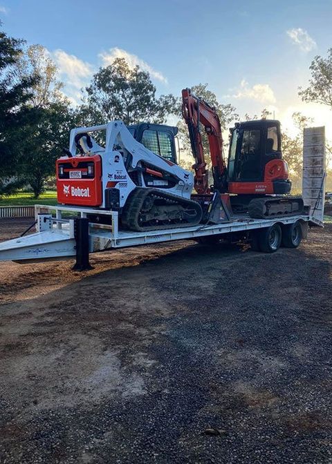 A Truck Carrying Two Excavators — Blue Gum Earthworks in Wongabel, QLD