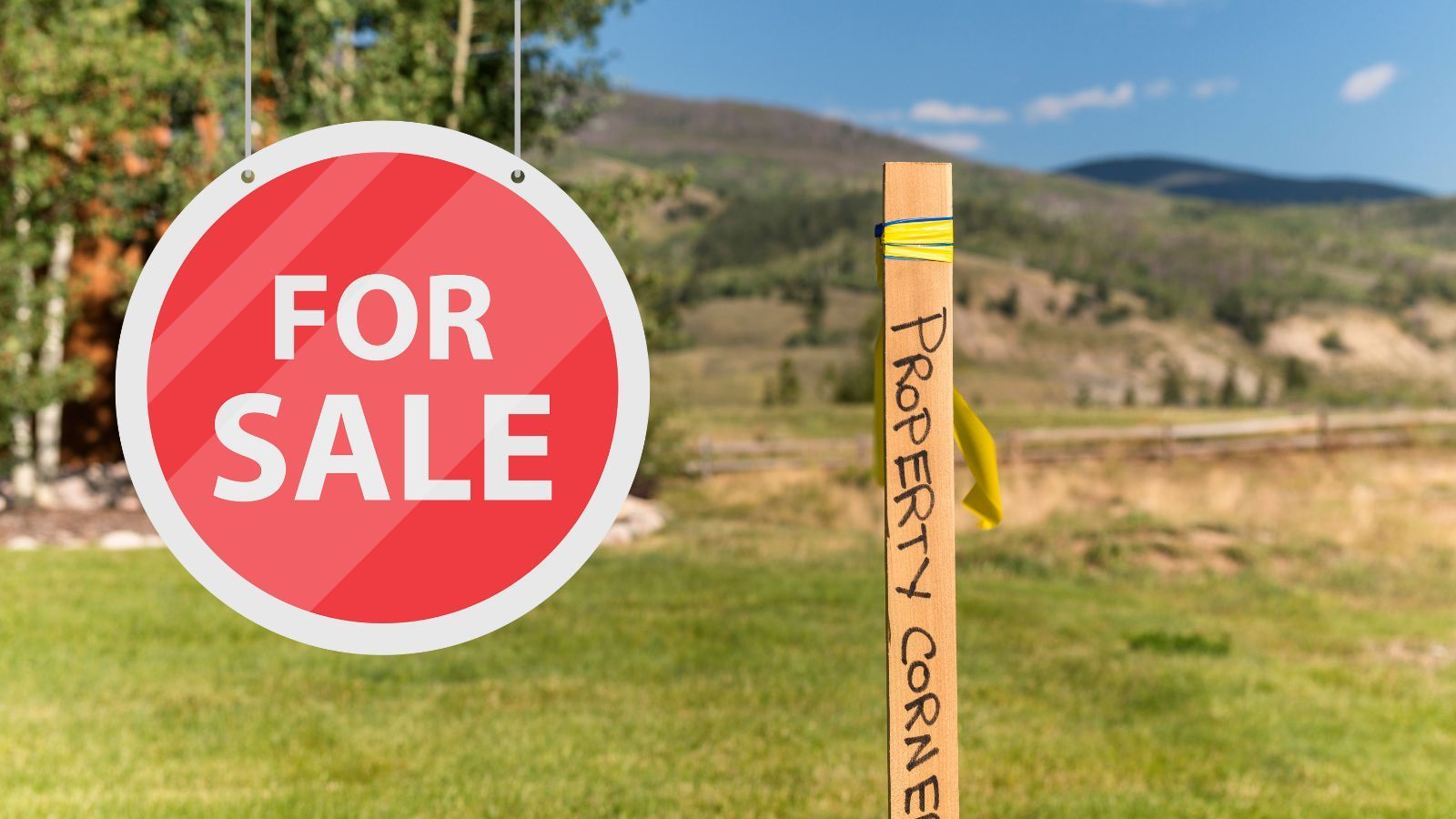 Property with land with a for sale sign