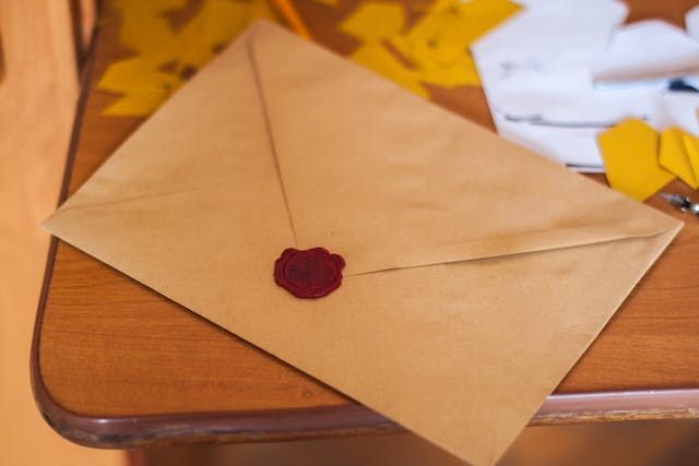 table-with-a-wax-sealed-envelope-on-top