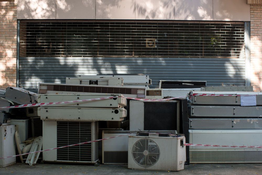 Disposing of Numerous Used Air Conditioners in a Heap — Professional Scrap Metal Recycling in Berrimah, NT
