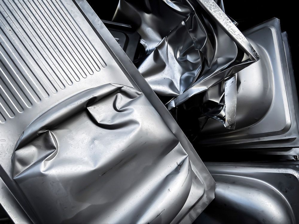 Multiple pieces of stainless steel scrap overlapping — Professional Scrap Metal Recycling in Darwin, NT