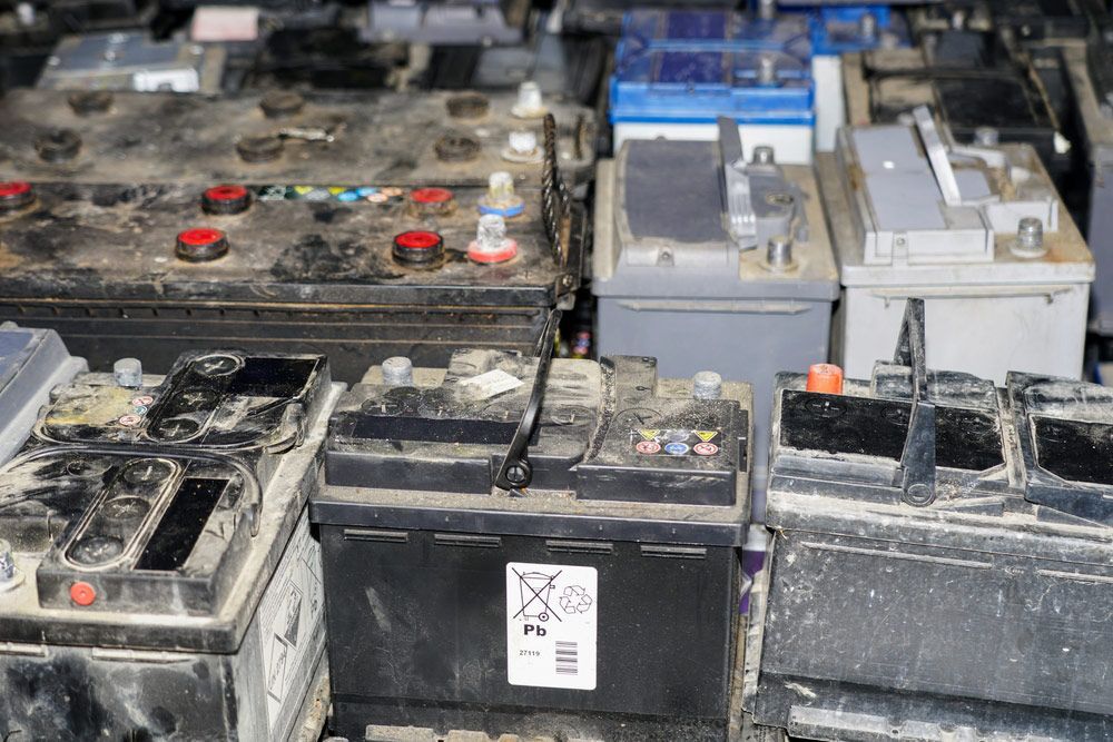 Pallet of Used Car Batteries at Scrap Yard — Professional Scrap Metal Recycling in Berrimah, NT