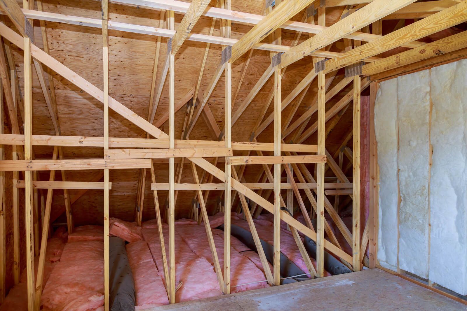 a crawl space with insulation inside