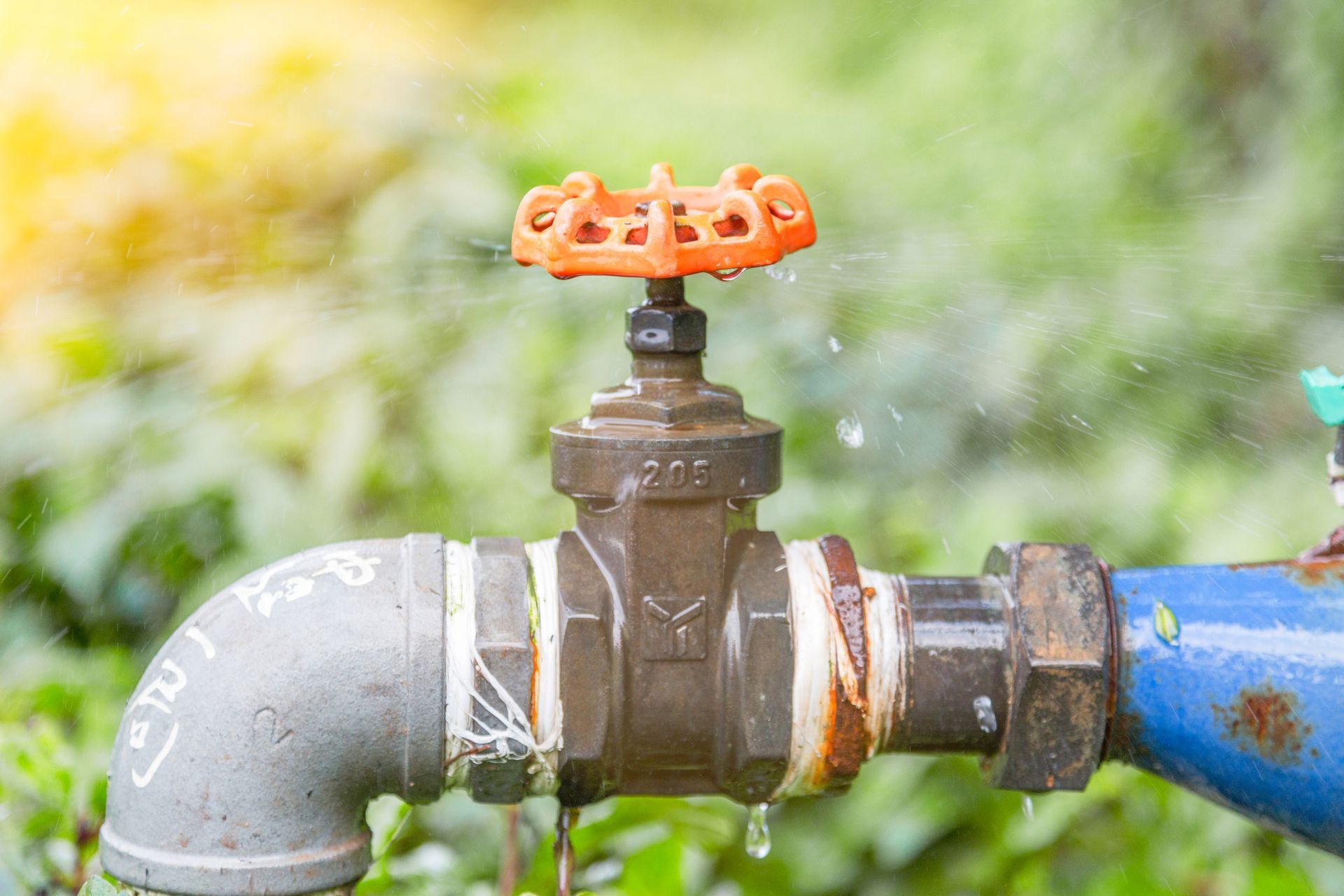 A close up of a faucet with water coming out of it.