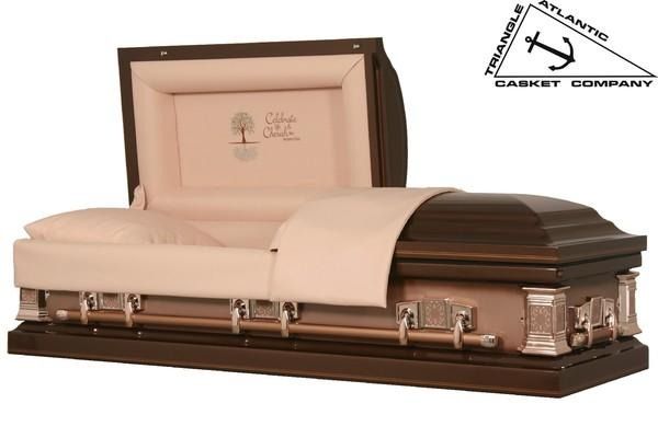 Open bronze casket with light pink interior and handles.