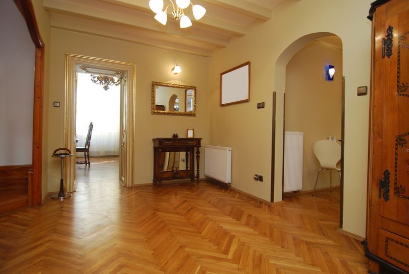 Refinished red oak parquet flooring in a vestibule