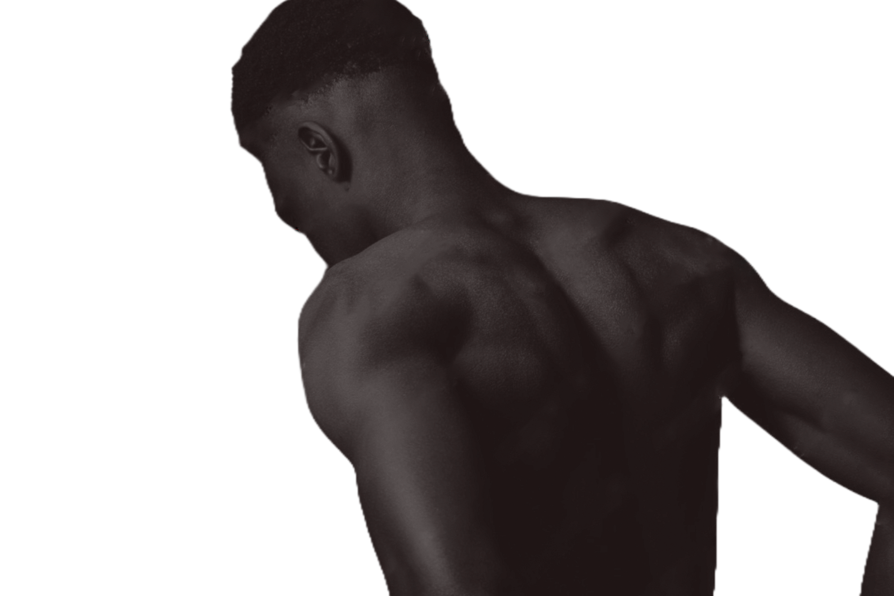Dark-skinned man, shirtless, from the back, looking down and to the side.