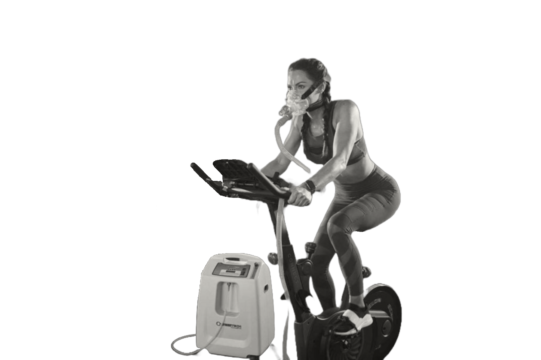 Woman on stationary bike wearing a mask connected to an oxygen tank in a gym setting.