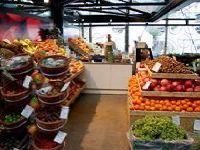 A grocery store filled with lots of fruits and vegetables.