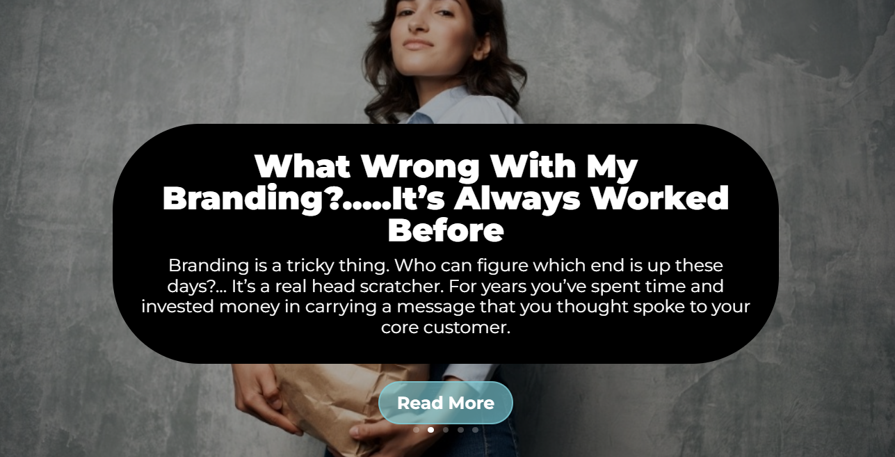 A woman is standing in front of a sign that says what wrong with my branding ? it 's always worked before.