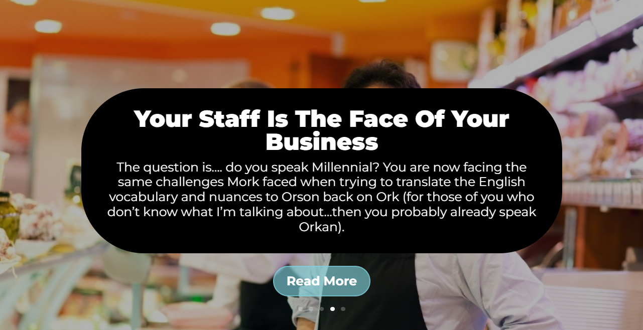 A man is standing in a grocery store with a sign that says `` your staff is the face of your business ''.